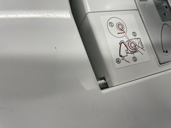 Insert the table into the sewing machine. Make sure all the tabs line up. You should hear a click when it is in.