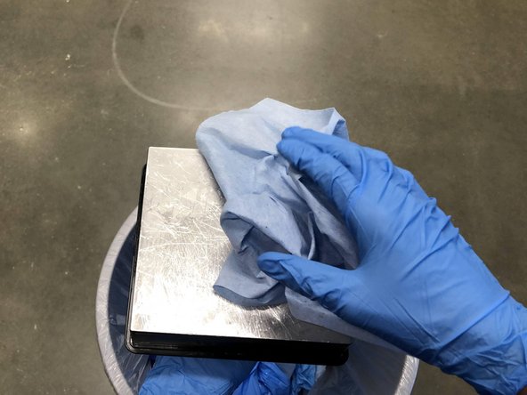 Spray down a paper towel with IPA and thoroughly wipe off the build surface