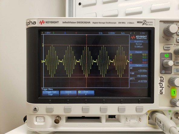 Shown on the oscilloscope is an AM signal from the function generator.