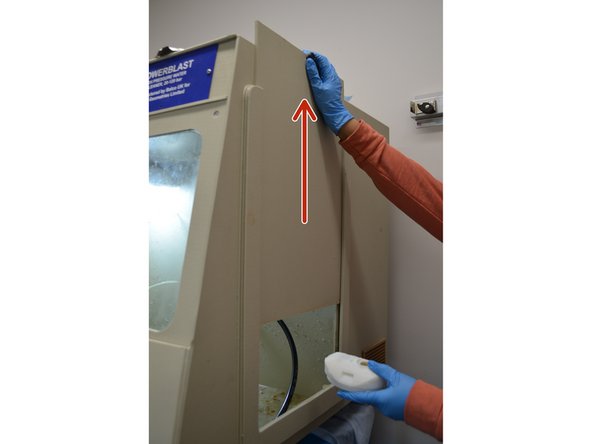 Lift the side panel on the right side of the washer and place the print on the center platform.