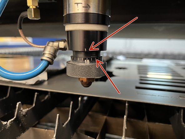 Turn the dial on the lens assembly until you see 4 small white lines, then turn the dial back to only show 3 lines so the 15 is in line with the white tick and there is a little bit of blank space after the 3rd white line. Otherwise, if you are cutting with oxygen, you're done.