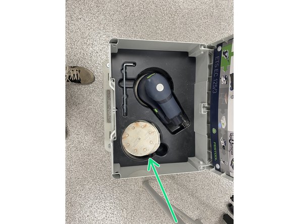 The inside of the case should contain the sander, hex wrench, power cable, and different sandpaper grits.