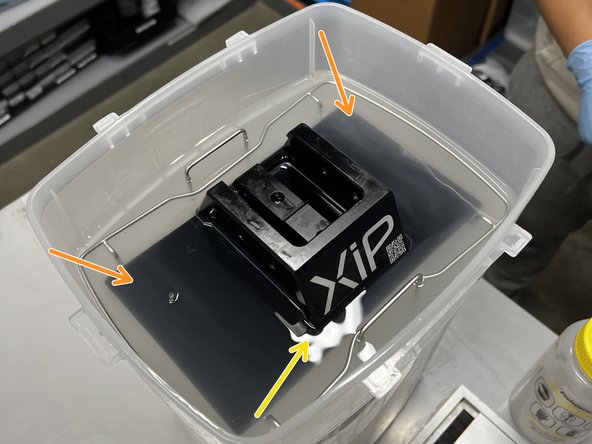 The build plate should rest on the rectangular metal frame.