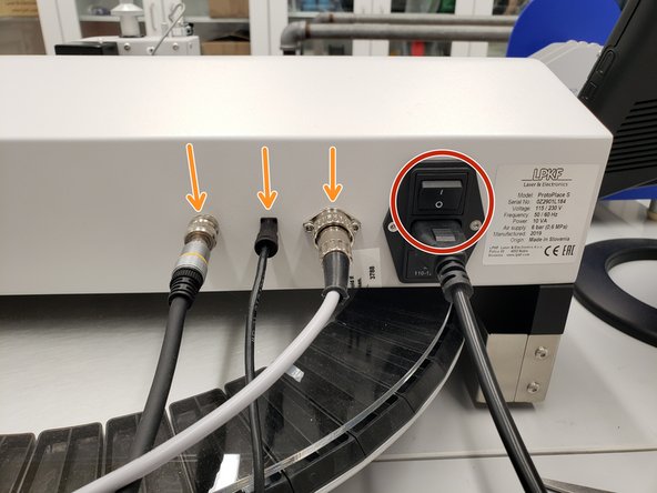 The power switch is located on the backside of the machine.