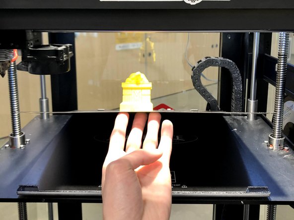 Lift the build plate off the magnetic bed from the front two corners