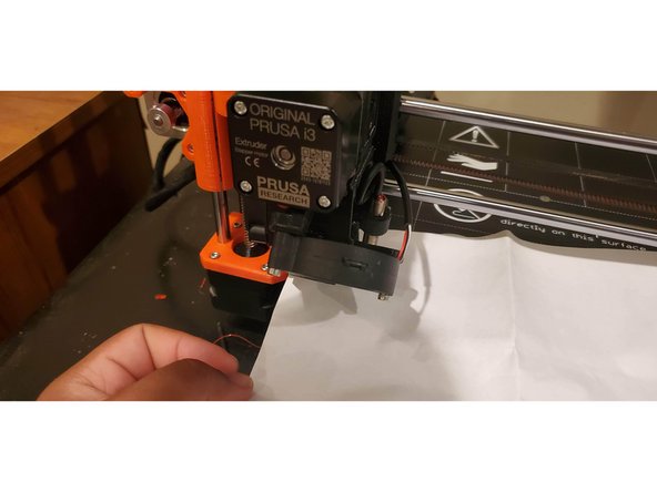 Hold a some paper under the extruder