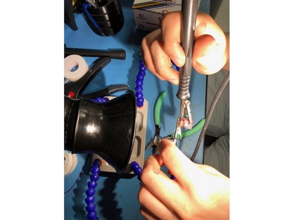 Move the wire all around each socket so there are no open holes in any of them. A magnifying glass can be helpful during this process.