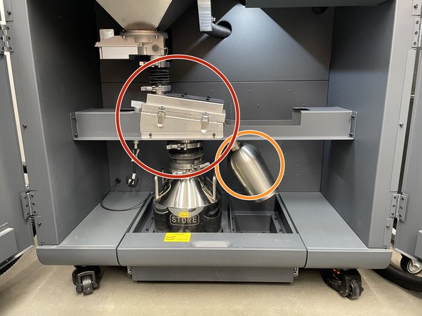 Turn of sieving and dosing, then open the bottom access doors
