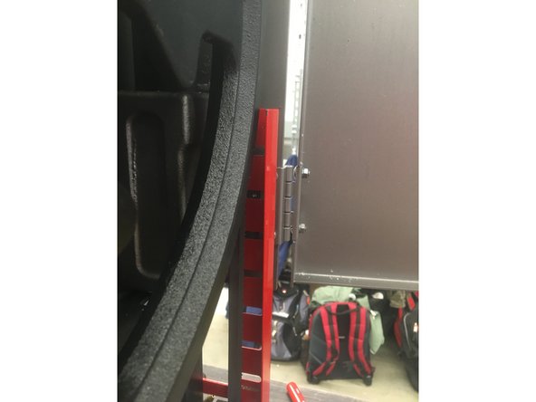 Ensure that the right red guard is secured back to the machine and that the blade is behind it.The guard should be tightened so that the guard is as close to the upper drive wheel as the bolt slots will allow.