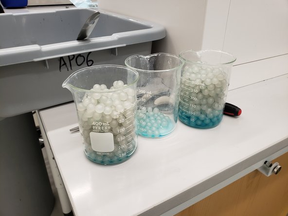 Use the slotted spoon to remove the balls and place them in glass beakers