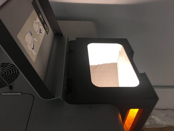 Open the hopper lid located at the top right of the Fuse