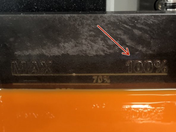 Follow the next on-screen prompt and begin filling the resin. There are lines on the back of the tank showing the different fill levels.