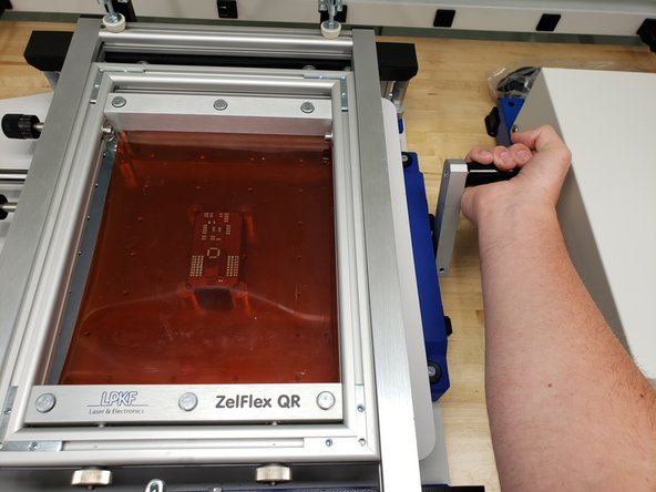 When ready, pull the lever on the right to raise the PCB.