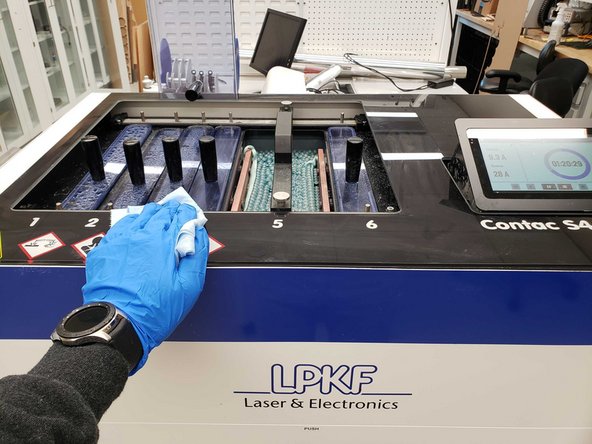 Wipe down the surfaces and lids of the Contac