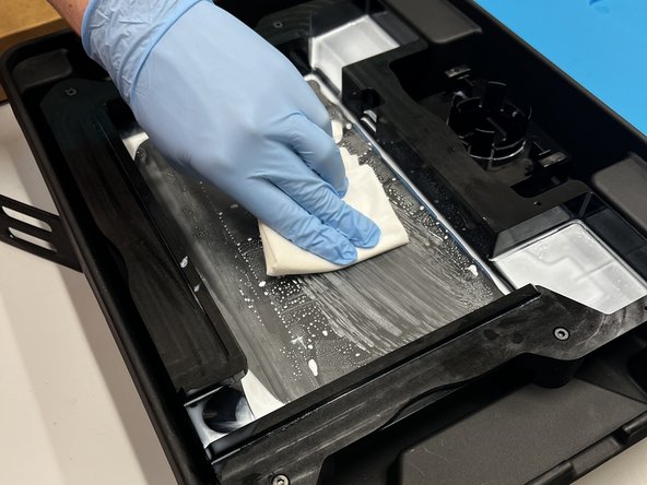 Place the emptied tank back in the storage box.