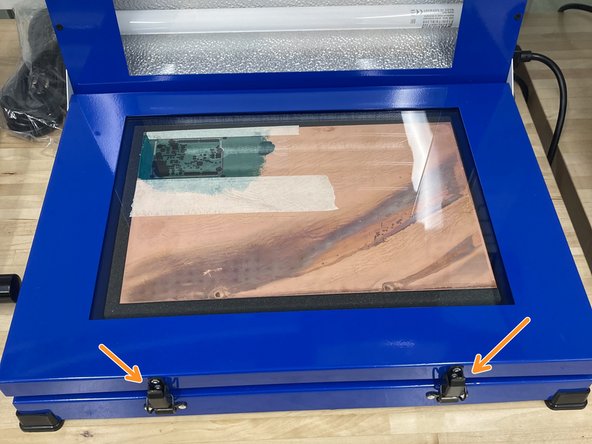 Place the PCB under the glass and latch it shut