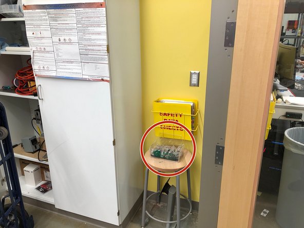 Glasses can be found hanging near the electronics workbench or in front of the SDS binder