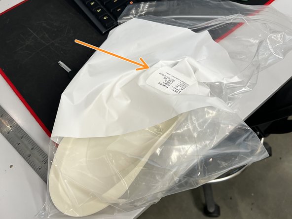 Place the model in a bag and apply the label to the bag.