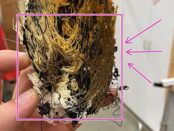 Use the long wire brush to clean the inside of the debris chute, reaching up from the bottom or down from the top as necessary