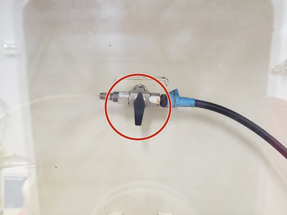 After inserting your hands into the yellow protective gloves,\you'll see 2 hoses. These hoses are controlled by a small valve.