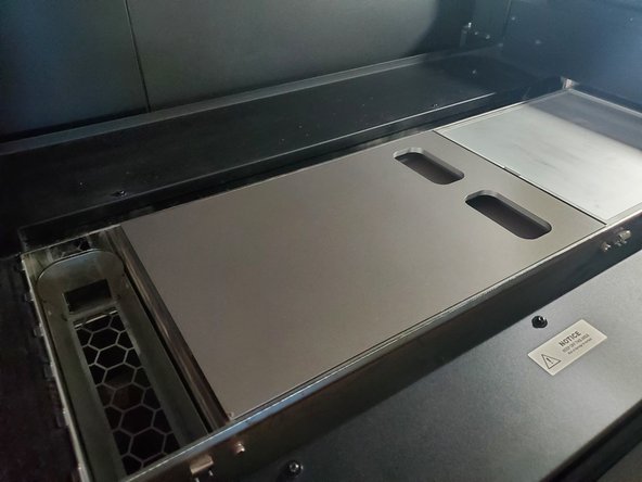 When prompted, open door and install test print fixture