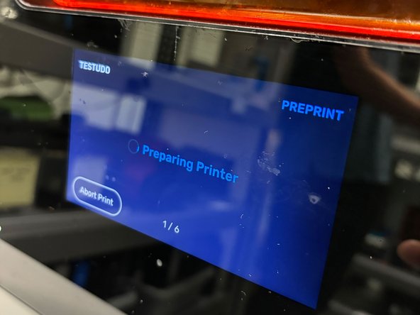 The tank will prepare for printing by filling the tank with resin, heating it to its printing temperature, and mixing the resin by moving the wiper back and forth