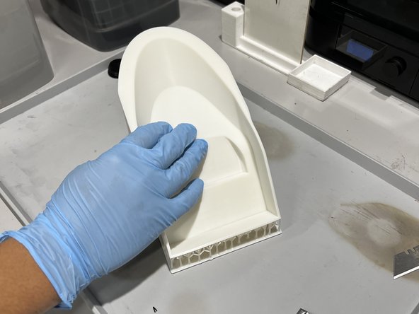 Check the model for any sticky surfaces or liquid resin.