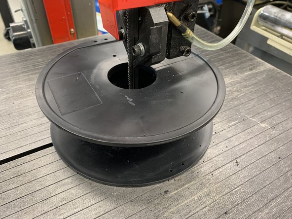 Begin by cutting through one side until you reach the center.