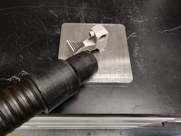 Slowly excavate part making sure to not overfill powder canisters