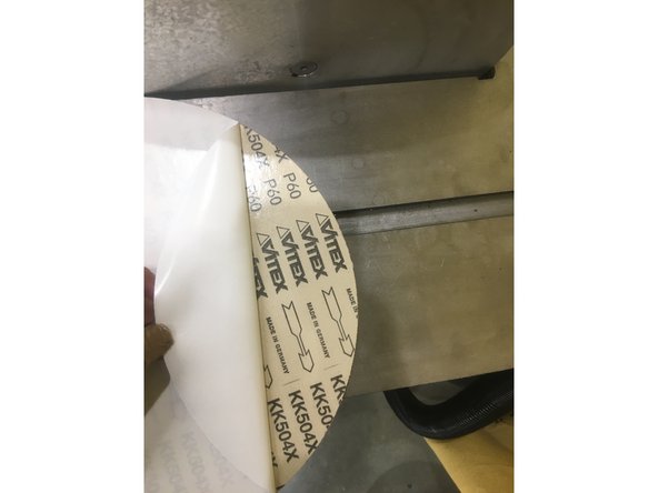 Remove the backing from the adhesive side of the new pad.