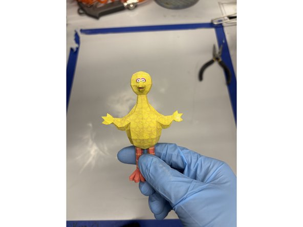 Turn the vacuum on and begin removing any excess dust on the part. Then turn your attention to the workspace and vacuum any accumulated sand.