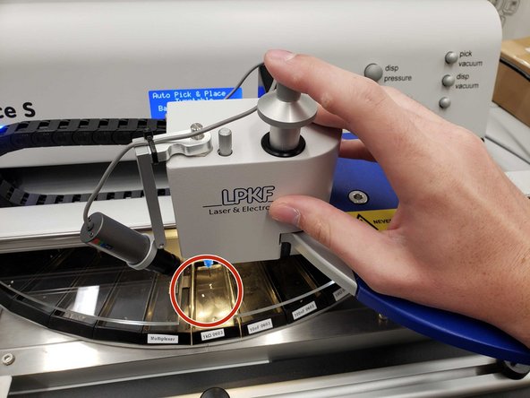 Move the manipulator over the desired component and push down the picking needle to pick it up.