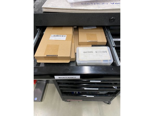 Locate the maintenance kit in the maintenance drawer.