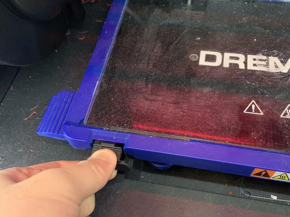 Place the glass build plate back into the Dremel