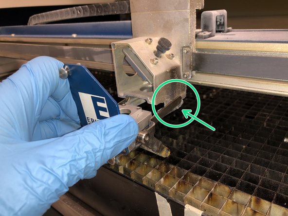 Reinstall the lens being careful to place the crash bar legs on the little pegs