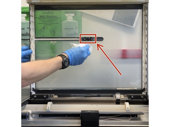 Dampen a Kim wipe with IPA and gently wipe the lens of the wide angle camera on the GF's lid