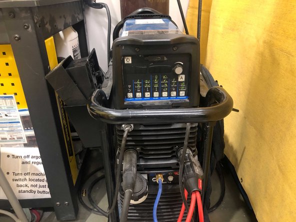 In the top left corner of the control panel is the standby power button. In order to turn the machine on, the main breaker(located on the back right corner of the machine)must be switched on. Pressing this button will not turn the machine on and off unless the breaker is on.