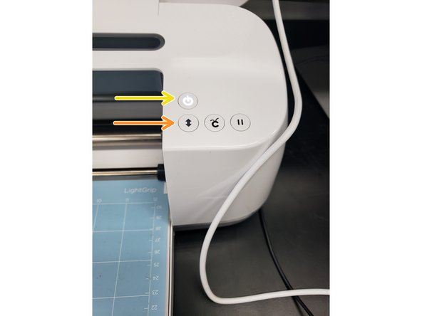 Press the flashing load/unload button on the machine