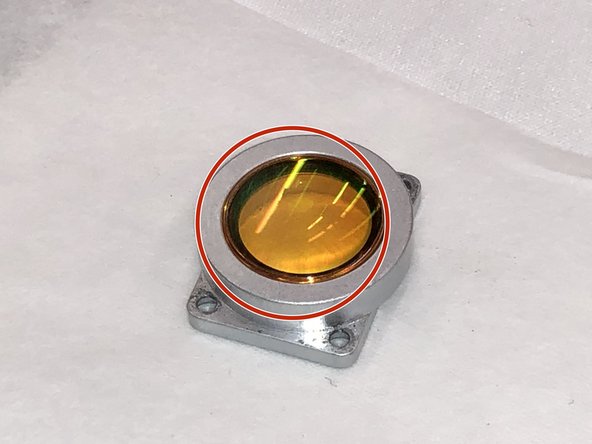 Ensure the flat side of the lens is facing upwards