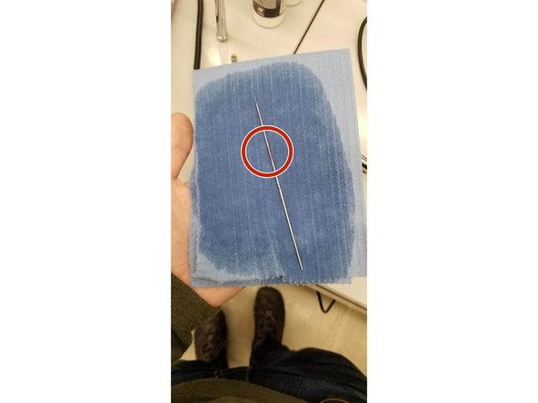 Wipe the needle down with IPA. Be gentle so you don't bend the needle and focus on any spots where paint has dried in place on the needle.