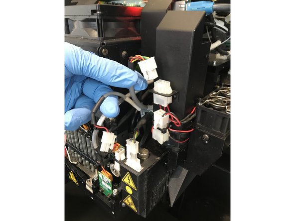 Loosen the screw holding up the &quot;straw&quot; and push the &quot;straw&quot; down until the red mark is just visible above the screws