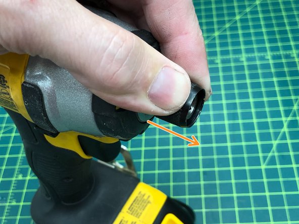 Pull up on the chuck, insert the bit and release to secure