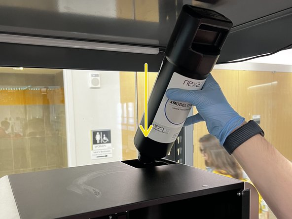 Insert the cartridge at the top of the machine.