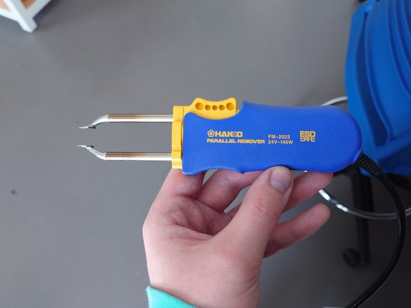The parallel remover should be used similarly to the soldering iron, just with two hot tips instead of one.
