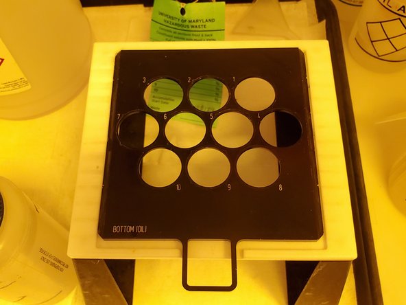 Place the cleaned substrate into the depression of the desired sample holder position. For ITO-coated and silicon substrates, ensure that the print surface is facing up.