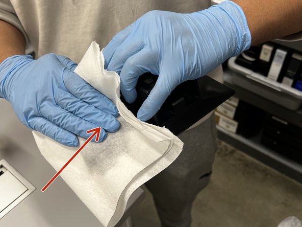 Wash all surfaces of the build plate with IPA and a paper towel. Ensure the build plate is completely dry, and all resin/debris is removed.