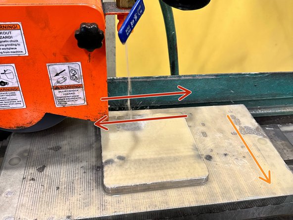 Now we will begin The fine resurfacing process. Start by clamping the plate down using the magnetic clamp on the carriage.
