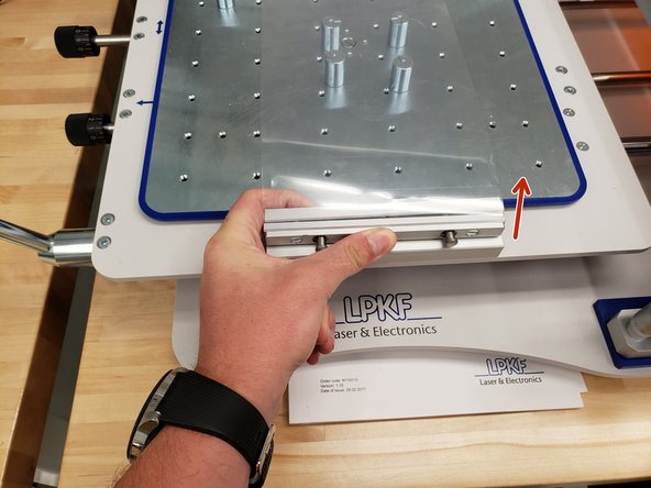 Remove the clear plastic protective shield by squeezing and pulling up.