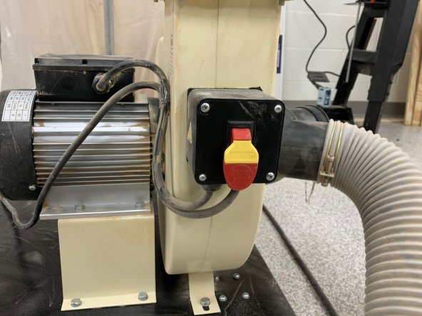 This dust collector is attached permanently to the table saw to collect excess dust produced by the table saw. Dust will still be kicked onto you, so be prepared to sweep and clean after use.