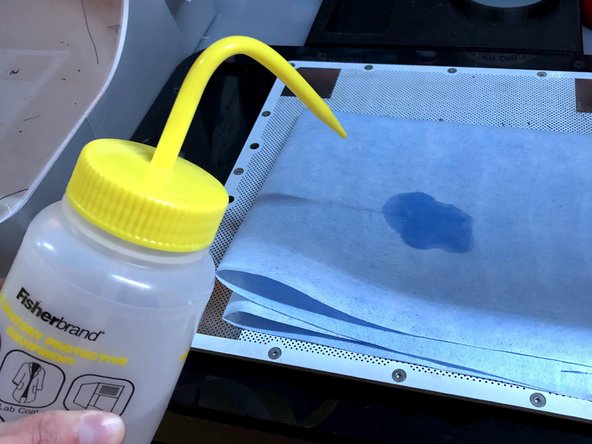 Use the edge of the spatula, and scrape over the area where the print was